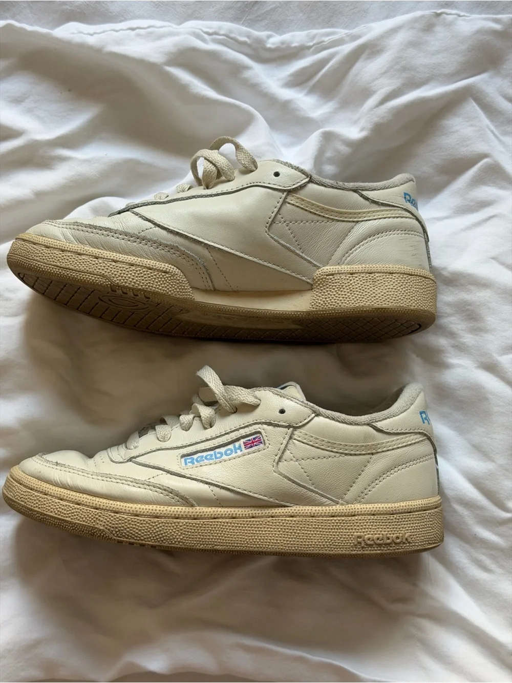 Reebok Kids Classic Leather Sneaker in Off-White with Blue and Red Accents